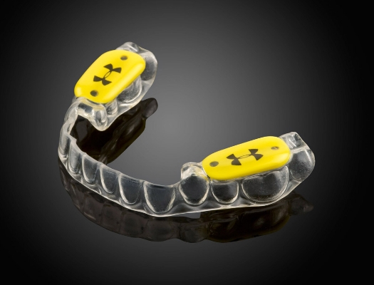 Close up of mouthguard with yellow attachments