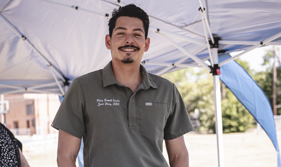 Dr Diaz standing outside under tent