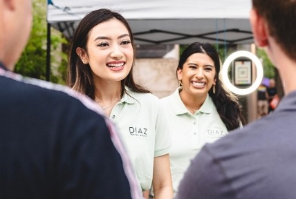 Dental team members talking to people