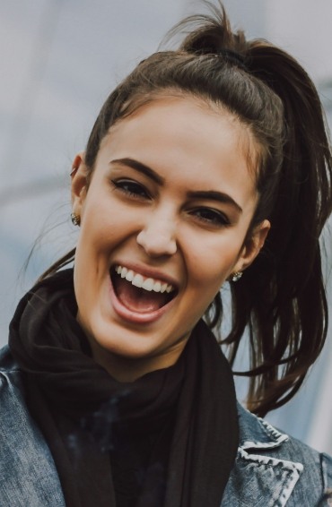 Close up of smiling woman with scarf