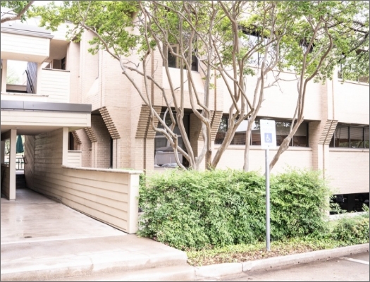 Shot of entrance to dental office from parking lot